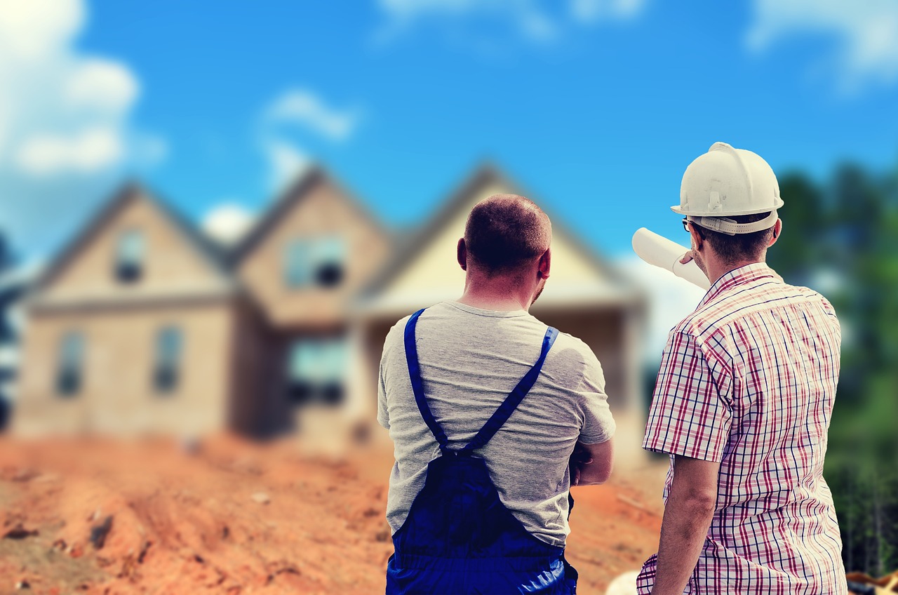 Builder and site manager overlooking property development